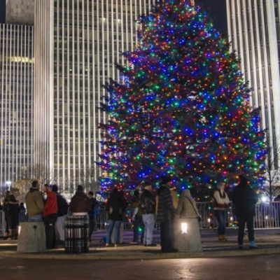 holiday images showcasing a tree lighting, fireworks, and holiday table decor