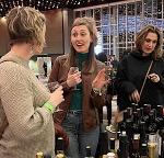 group of people at an indoor wine festival
