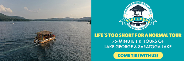 banner advertising tiki tours with a tiki boat floating on lake george