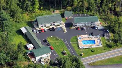 aerial view of motel with pool