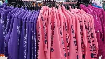 rack of carhartt hoodies in store