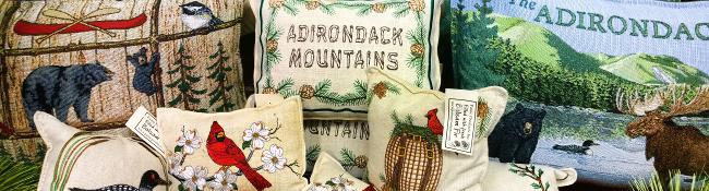 adirondack-themed holiday pillows on display