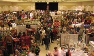 crowds of vendors at a holiday craft marketplace