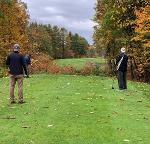 people on golf course in fall