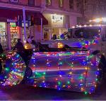 holiday event in ballston spa with lit-up tractor