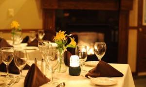 set table in restaurant by fireplace