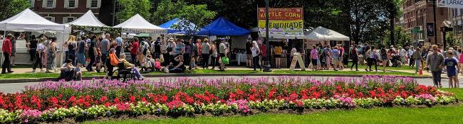 springtime in glens falls at event with vendors and crowd