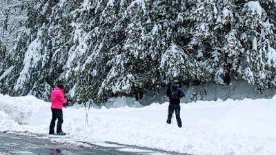 two people snowshoeing