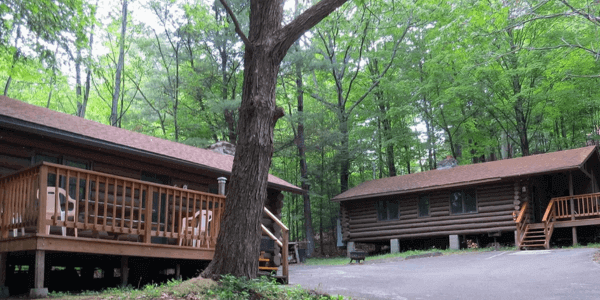 Log cabins side by side at Candlelight Cottages in Lake George 