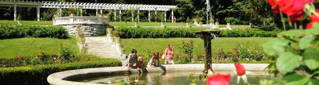 mom and kids look at fountain in yaddo gardens