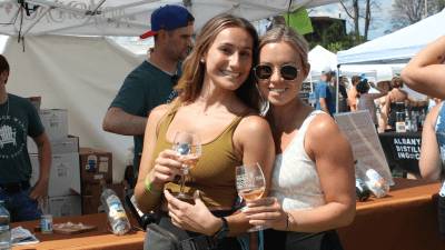 two women pose at adirondack wine and food festival