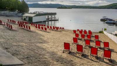 lake beach with red chairs