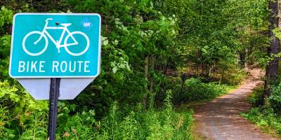 bike route sign by bike route in the woods