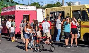 people and food trucks at the shirt factory