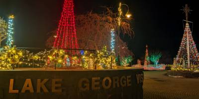 lake george visitor center sign and holiday lights