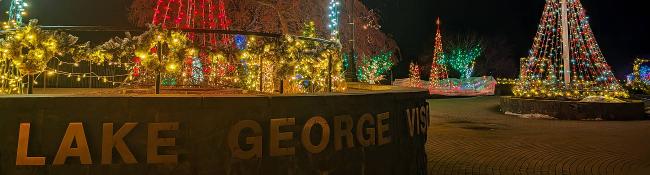 lake george visitor center sign and holiday lights