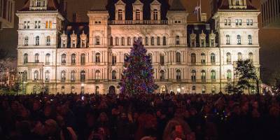 christmas tree lit up in front of albany capitol