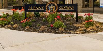 spring flowers by albany skyway sign