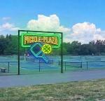 pickle plaza sign by pickleball courts