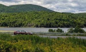 car driving down adirondack road