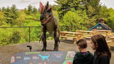 little kids at dino exhibit