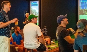 guys hanging out at indoor golf simulators