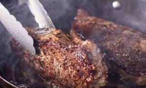 steak cooking in pan