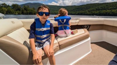 two kids on a boat