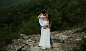 bride and groom on mountaintop