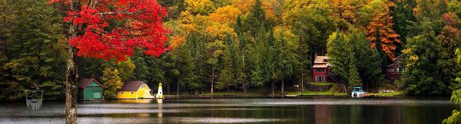 view of Old Forge Pond with some splashes of fall color on the trees