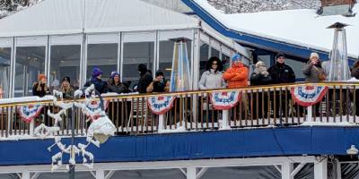 people on deck at lake george beach club in winter