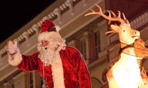 santa in parade waves