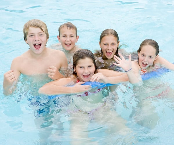 Kids Swimming At Summer Camp